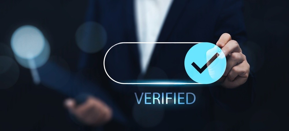 Professional holding a verified SkillCert Global certificate